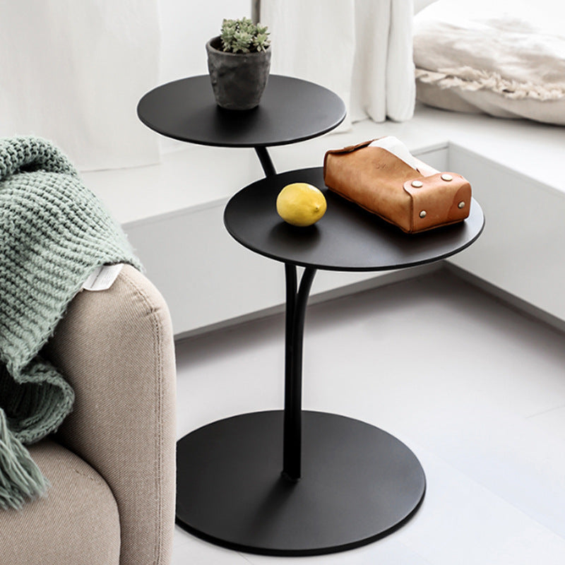Close-up of the baking varnish finish on the Nordic metal round side table surface
