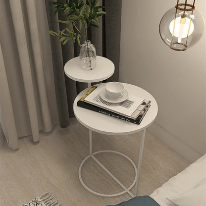 Compact Nordic round side table fitting beside a sofa without blocking room walkway
