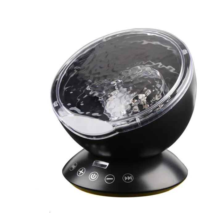 Ocean wave projector with audio speaker casting blue light on ceiling