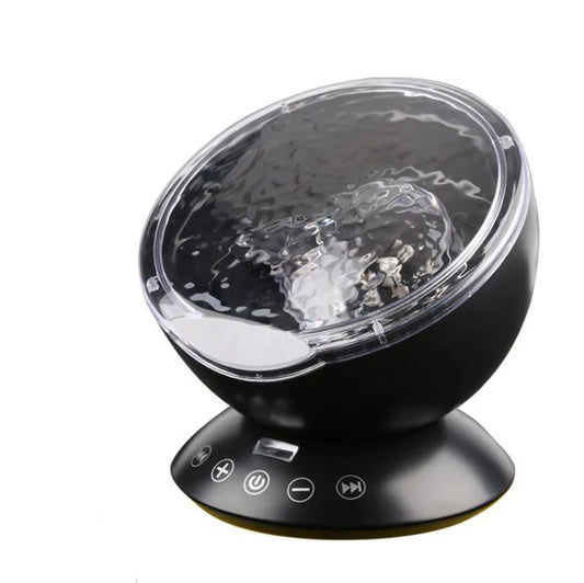 Ocean wave projector with audio speaker casting blue light on ceiling