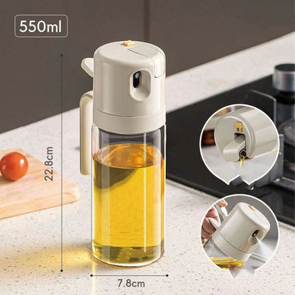 Olive oil sprayer bottle spraying oil on food
