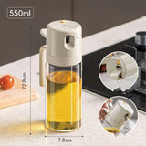 Olive oil sprayer bottle spraying oil on food