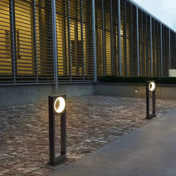 Waterproof outdoor lamp installed on garden patio pathway