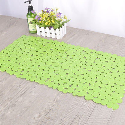 Underside of the pebble PVC bathroom mat showing flat non slip base on tile floor
