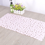Pebble design non slip PVC mat in a clean modern white tile bathroom setting
