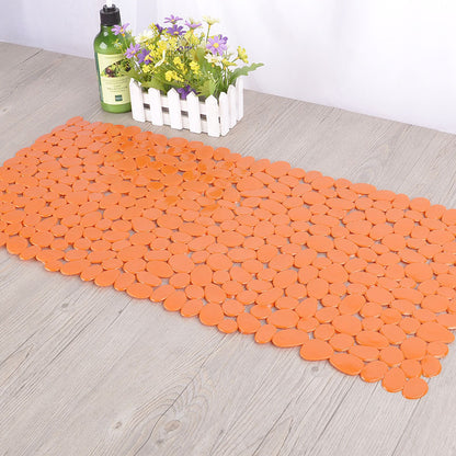 Eco friendly pebble PVC mat covering the standing area inside a standard shower stall
