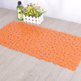Eco friendly pebble PVC mat covering the standing area inside a standard shower stall
