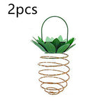 Woman holding pineapple solar fairy light in garden