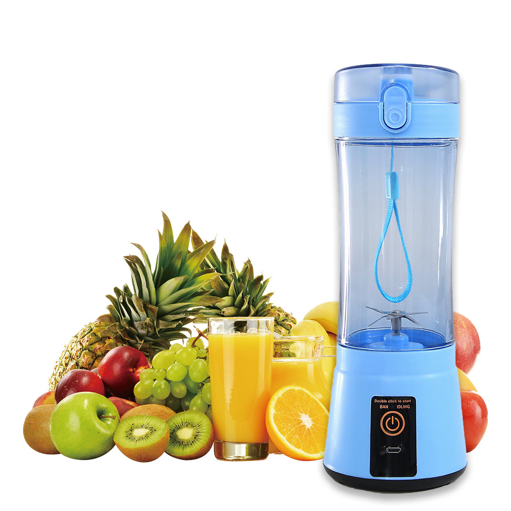 Portable blender cup with fresh fruits on counter