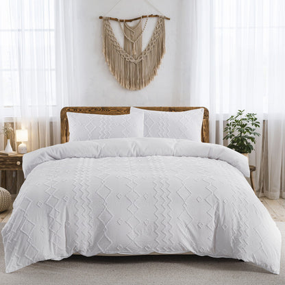 White quilt comforter set on a bed in a bedroom with decorative elements.