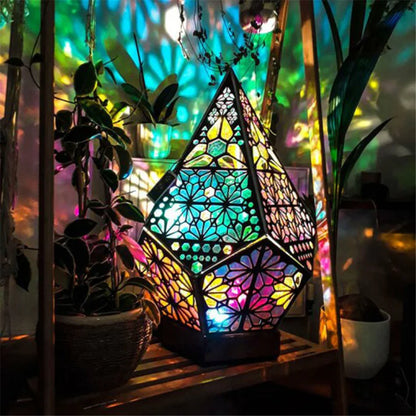 Geometric projection lamp glowing purple in dark room