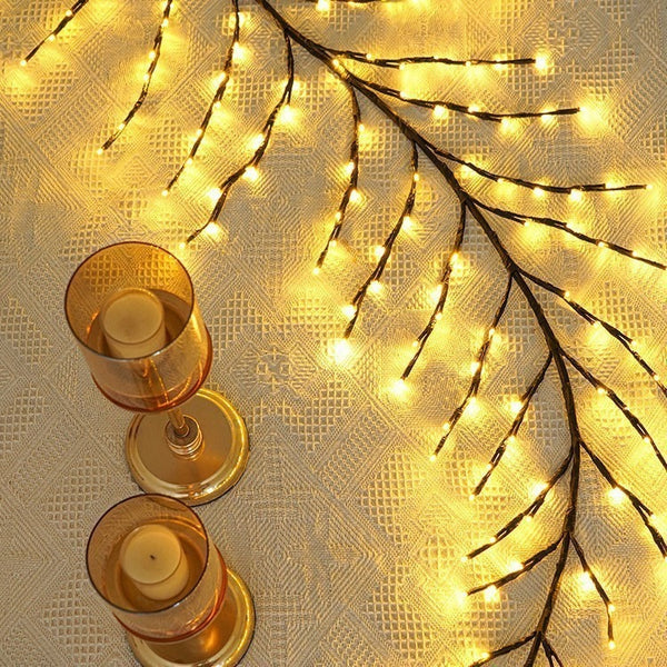 Gold leaf detail on rattan Christmas tree lamp with warm ambient glow
