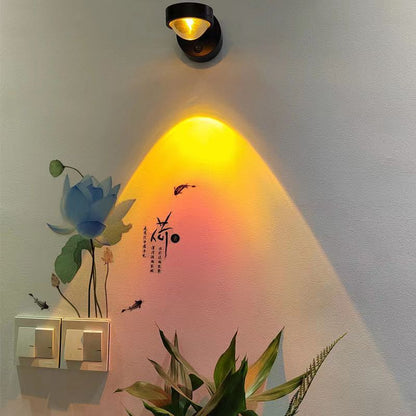 USB cable plugged into the rechargeable sunset wall lamp for charging on a nightstand
