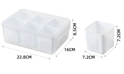 Close-up of plastic compartment container with chopped green onions and fresh vegetables