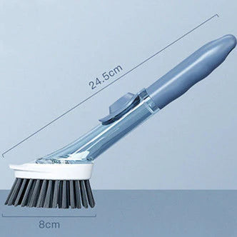Hand using cleaning brush with removable head on dishes
