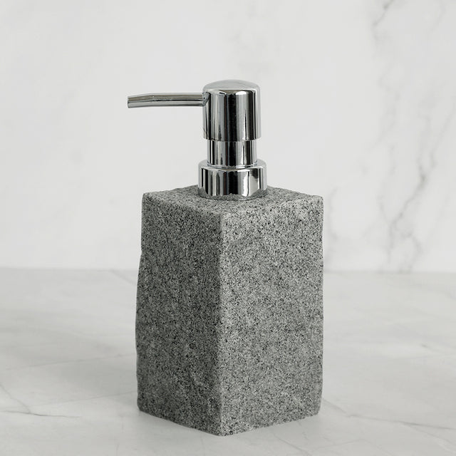 Grey resin soap dispenser from 4 piece bathroom set