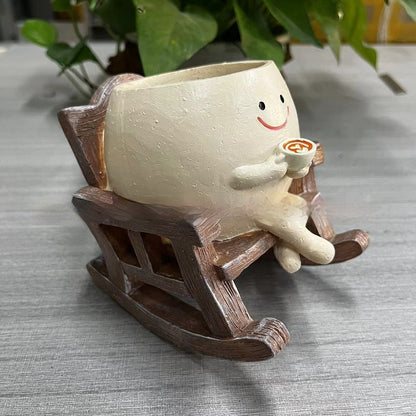 Resin lady rocking chair succulent pot empty close up