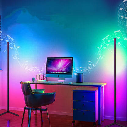 RGB corner floor lamp beside gaming desk setup