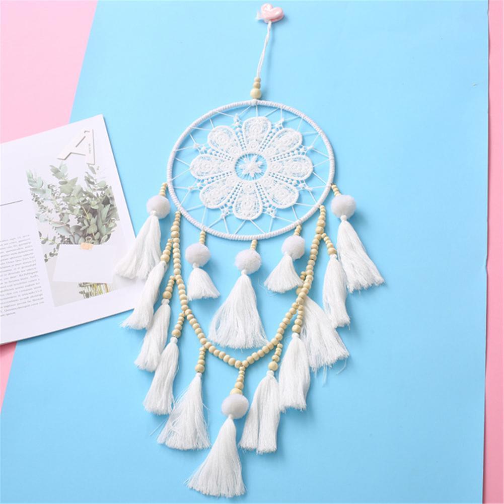 Close-up of the wooden beads and iron ring detail on the romantic decorative wall dream catcher
