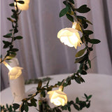 Rose leaf garland fairy lights used as wall decor