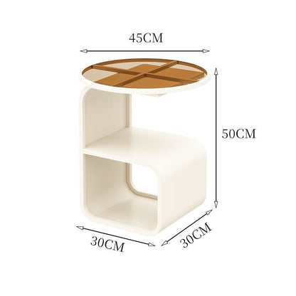 Modern round tempered glass sofa side table styled in a complete minimalist living room setup
