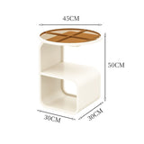 Modern round tempered glass sofa side table styled in a complete minimalist living room setup
