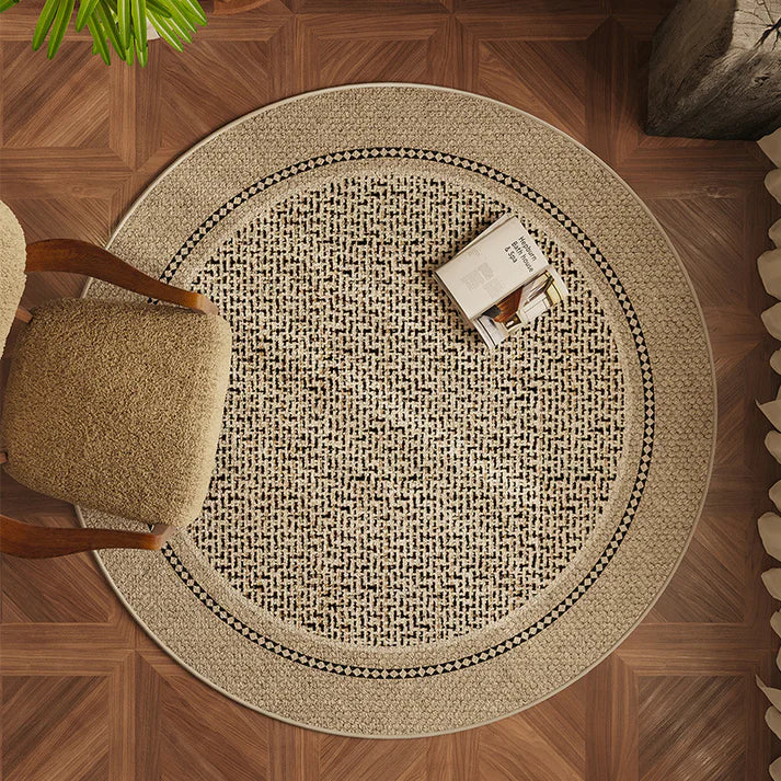 Round living room carpet placed under sofa in modern home interior setting
