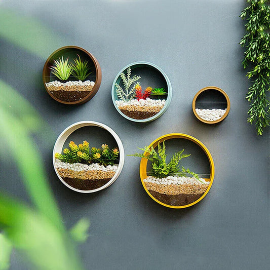 Multiple round wall vase flower art pieces displayed together