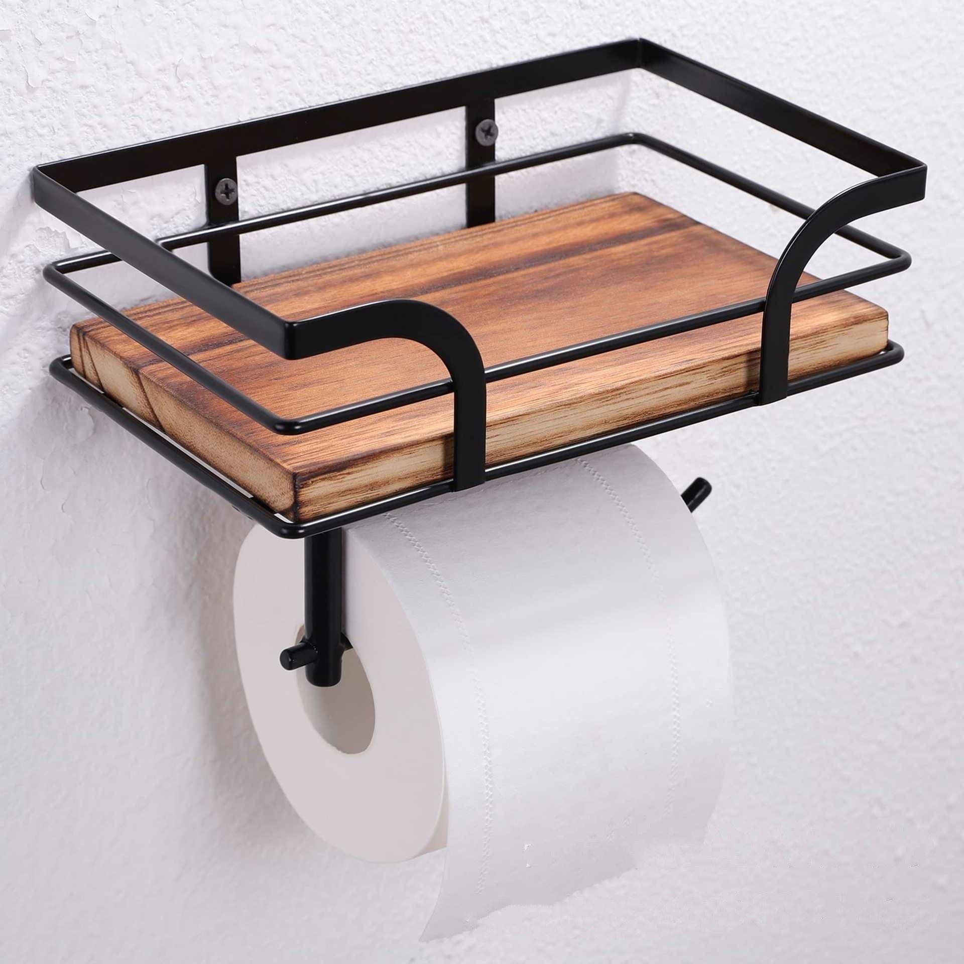 Standard US toilet paper roll loaded into the rustic wood and iron freestanding holder
