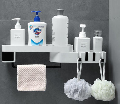 White rotating shower shelf holding shampoo and soap bottles