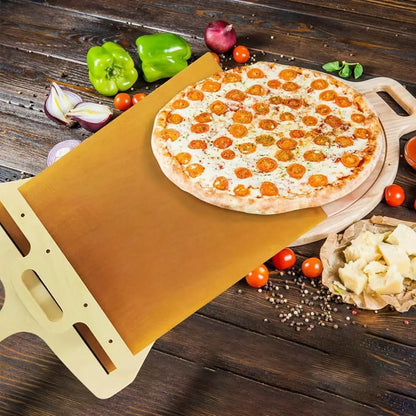 Sliding pizza shovel with freshly baked pizza on wooden surface