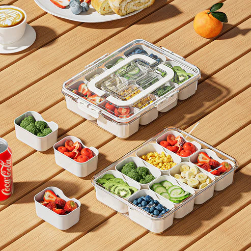Airtight snack box organizer used outdoors at picnic with fruits and snacks inside