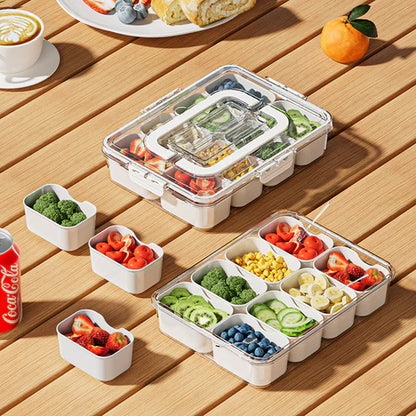 Airtight snack box organizer used outdoors at picnic with fruits and snacks inside