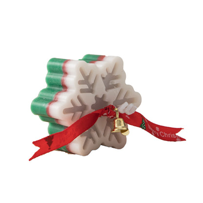 Snowflake candle styled as Christmas gift decoration