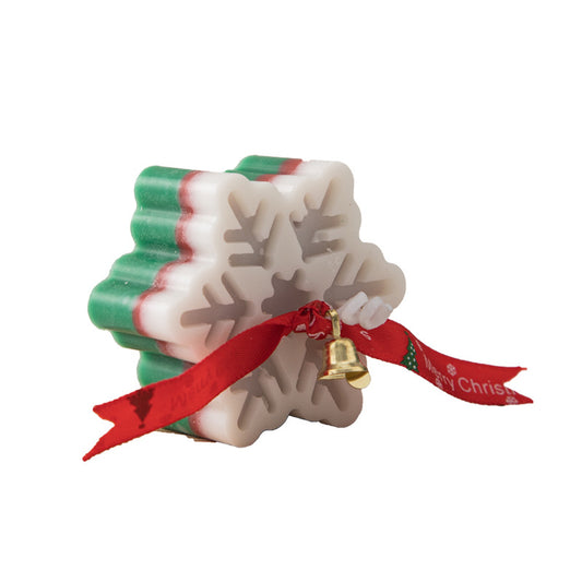 Snowflake candle styled as Christmas gift decoration