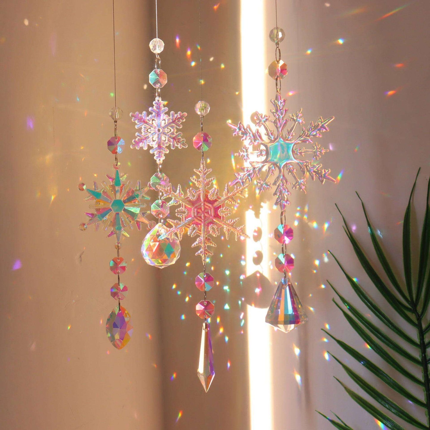 Snowflake crystal sun catcher ornament hanging with multiple colors
