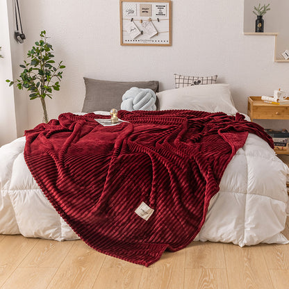 Queen size soft fleece blanket folded down to a compact size for travel or storage
