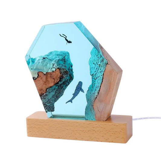Solid resin lamp with whale diver design front view