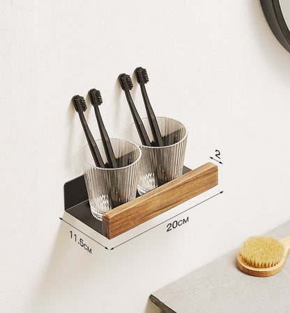 Solid wood floating wall shelf holding toothbrush cups