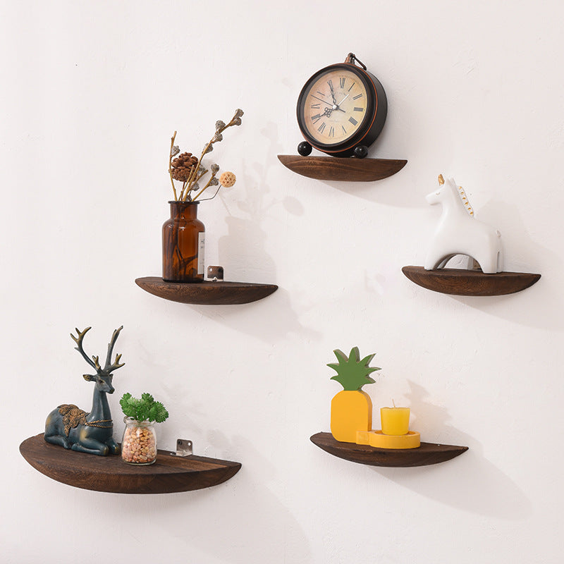 Solid wood wall shelf in pine log color mounted on a white bedroom wall