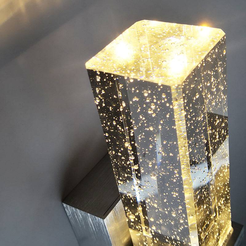 Splendas LED crystal bubble wall lamp creating ambient glow in dark room setting