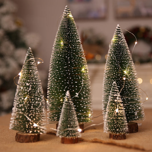 Close up of Splendas mini white cedar snow frosted Christmas pine tree ornament on wooden base