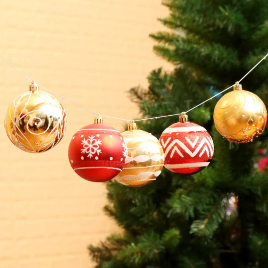 Splendas PVC bright red Christmas ball ornaments hanging on decorated festive tree