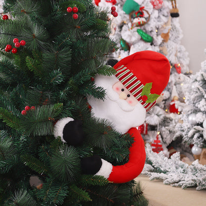 Splendas Santa Claus plush Christmas tree topper figurine placed on decorated green tree