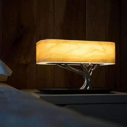 Splendas tree light table lamp Bluetooth speaker creating ambient glow in dark room