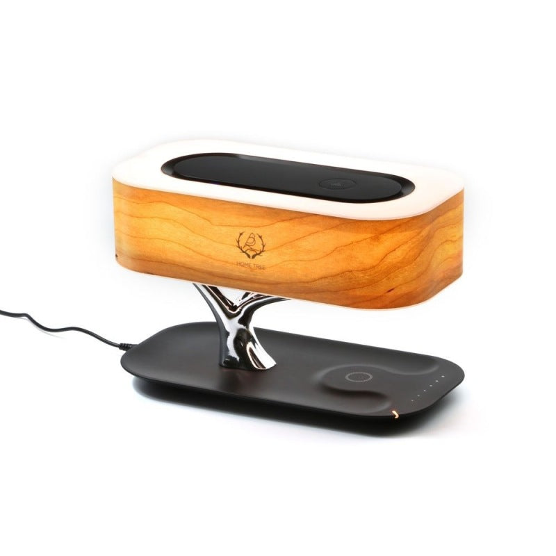 Side angle full view of Splendas creative tree light table lamp with Bluetooth speaker