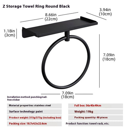 Full size bath towel folded over a stainless steel wall mounted oval towel ring

