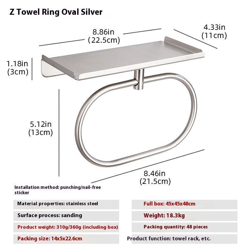 Silver round stainless steel towel ring in a guest bathroom with a neatly folded white towel
