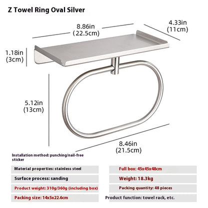 Silver round stainless steel towel ring in a guest bathroom with a neatly folded white towel
