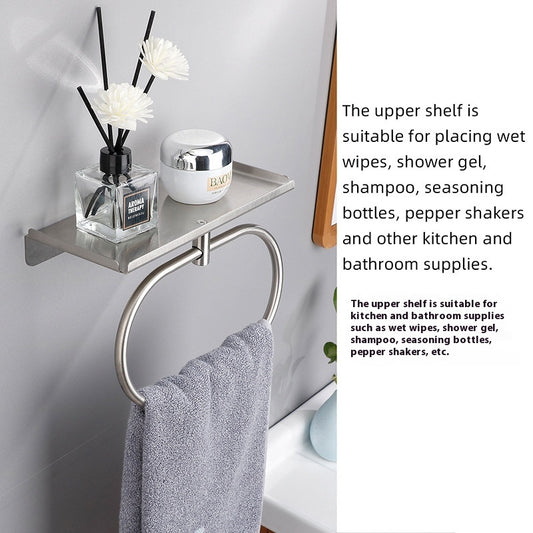 Silver oval towel ring screwed into a bathroom wall beside a modern vanity

